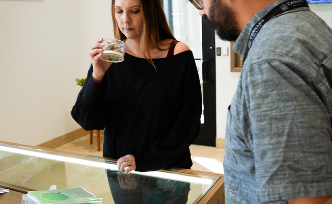Cannabis Health associate helping browse our selection